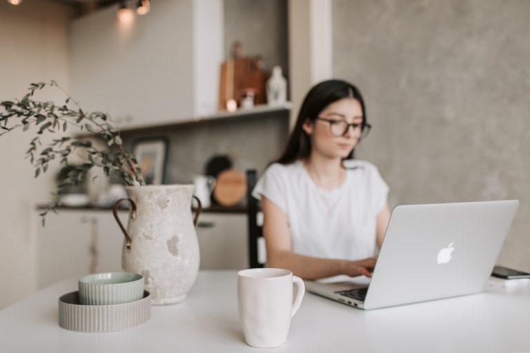 focused-young-businesswoman-working-remotely-at-home-4050327